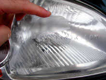 Circle of Headlight Armor Being Applied